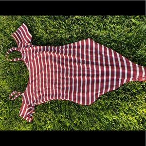 A striped burgundy and white body suit.